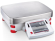 OH EX12001 Explorer Scale 12000g / 0,1 g Ohaus Explorer Scale 12000g / 0,1 g Ohaus
Intelligent Performance No Matter How Difficult the Task!
Application
Weighing (17 units + custom units), parts counting, percentage weighing, animal/dynamic weighing, check weighing, filling, totalization, formulation, differential weighing, density determination, peak hold, ingredient costing, pipette adjustment (except for Explorer High Capacity), gross/net/tare weighing

Display
High resolution 5.7” (145mm diagonal) full colour VGA touch display including QWERTY, detachable and numeric key pads plus weighing capacity indication

Operation
AC adapter (included) or rechargeable battery (High Capacity models only)

Communication
Easy access communication ports including 2 units of USB port, RS232 and an optional 4th Ethernet port, GLP and GMP including date and time, Direct Data Transfer, print to USB drive

Construction
Modular design, metal base, ABS top housing, stainless steel pan, glass draftshield with top mounted side doors and flip/sliding top door (1mg models only), illuminated up-front level indicator, integral weigh below hook, security bracket, Adjustment lock, four touchless sensors, full housing in-use cover

Design Features
Selectable environmental filters, auto tare, user-selectable span Adjustment points, software lockout and reset menu, user-selectable communication settings and data print options, user-definable project and user IDs, auto standby, up to 14 operating language

https://youtu.be/VTQRw0KNV50 OH EX12001